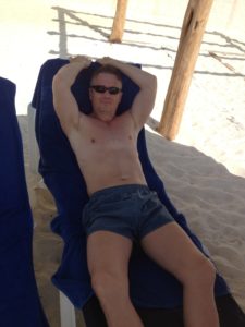 Todd relaxing on the beach in Cancun